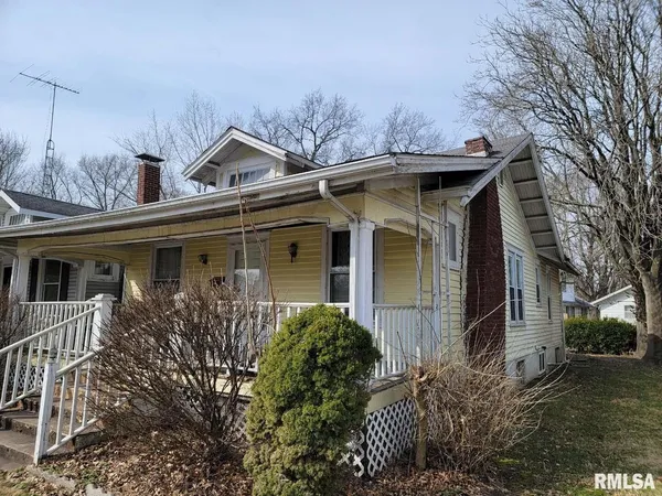 front view of a house with a small yard