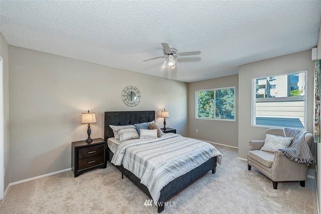 a bedroom with a bed and a couch