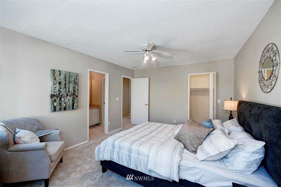 7501 Old Redmond Road, Unit 414 Redmond, WA 98052 - Photo 15 of 22 a bedroom with a bed couch and window