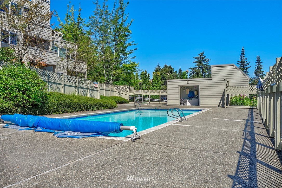 7501 Old Redmond Road, Unit 414 Redmond, WA 98052 - Photo 19 of 22 a view of backyard with swimming pool and seating area
