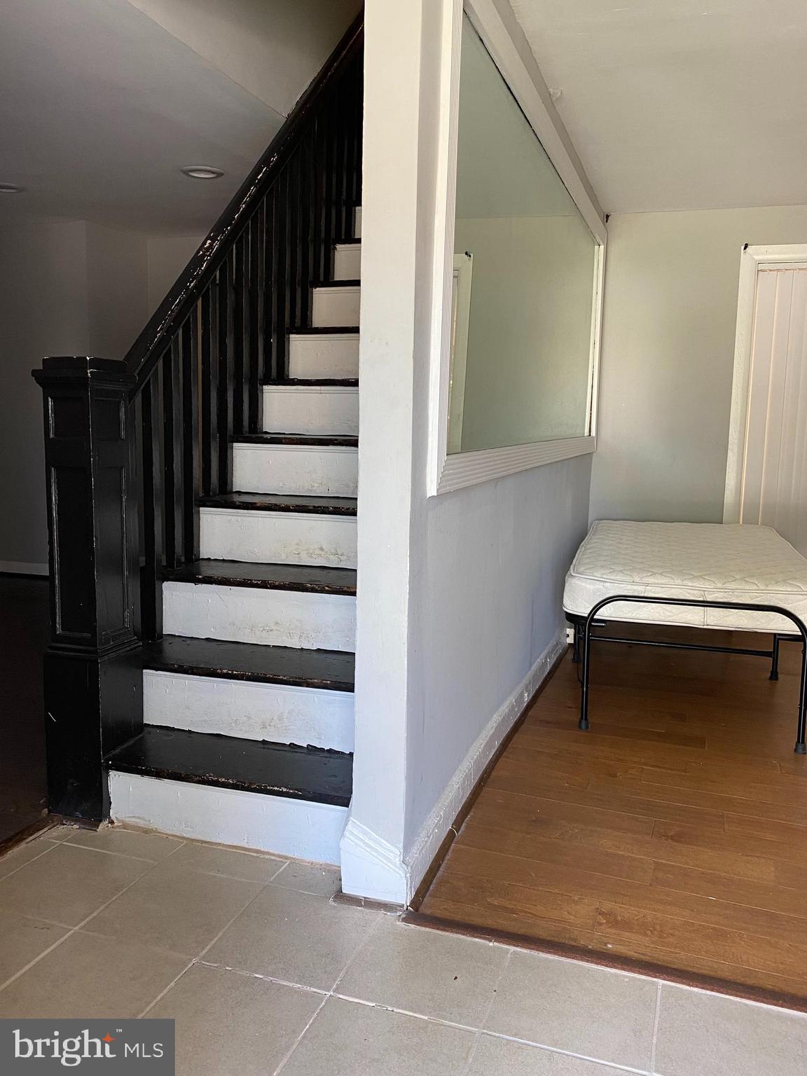 3120 North Rolling Road Baltimore, MD 21228 - Photo 22 of 57 Hardwood steps going upstairs