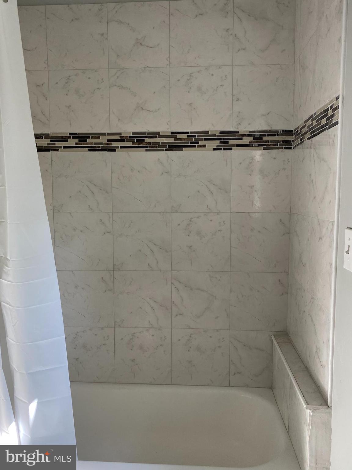 3120 North Rolling Road Baltimore, MD 21228 - Photo 29 of 57 Beautiful Tiled shower surround