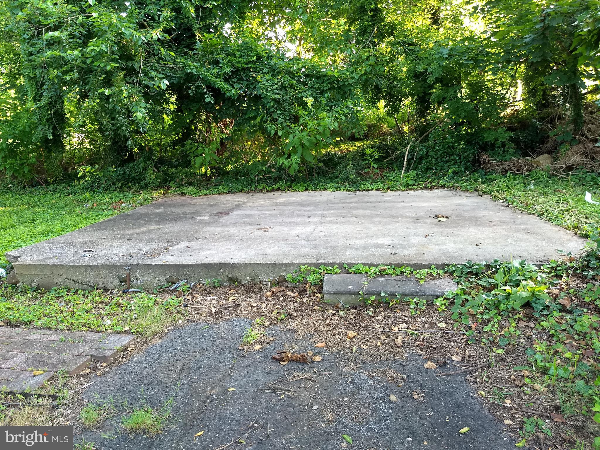 3120 North Rolling Road Baltimore, MD 21228 - Photo 38 of 57 Concrete Slab in Rear Yard for outhouse building