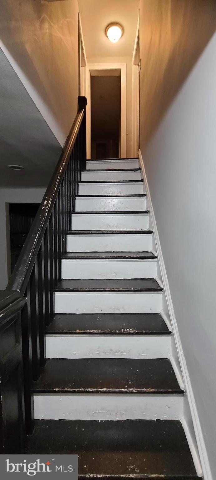 3120 North Rolling Road Baltimore, MD 21228 - Photo 54 of 57 Walnut colored hardwood steps