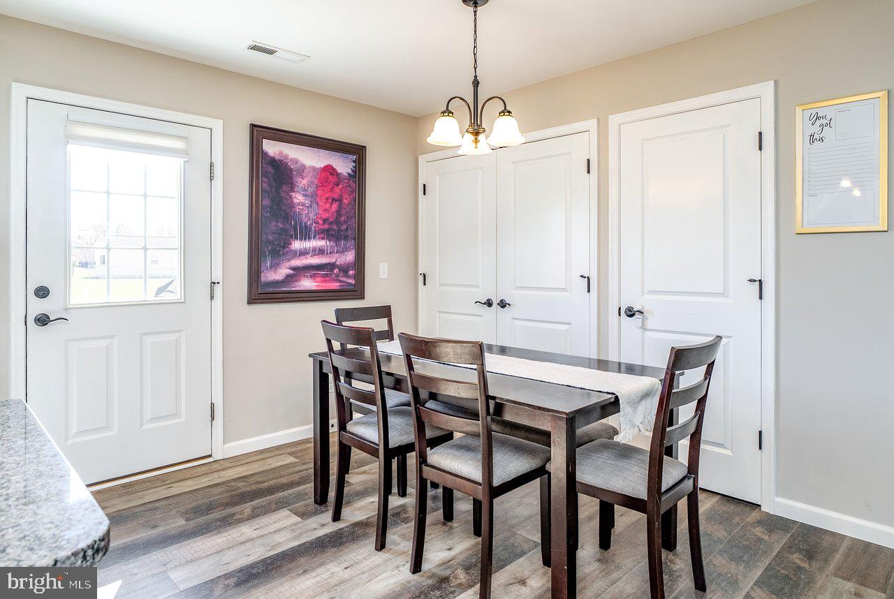 107 8th Street Grottoes, VA 24441 - Photo 20 of 45 a view of a dining room with furniture window and wooden floor