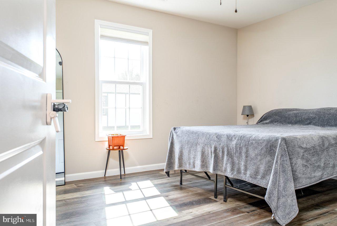 107 8th Street Grottoes, VA 24441 - Photo 22 of 45 a bedroom with a bed and a window