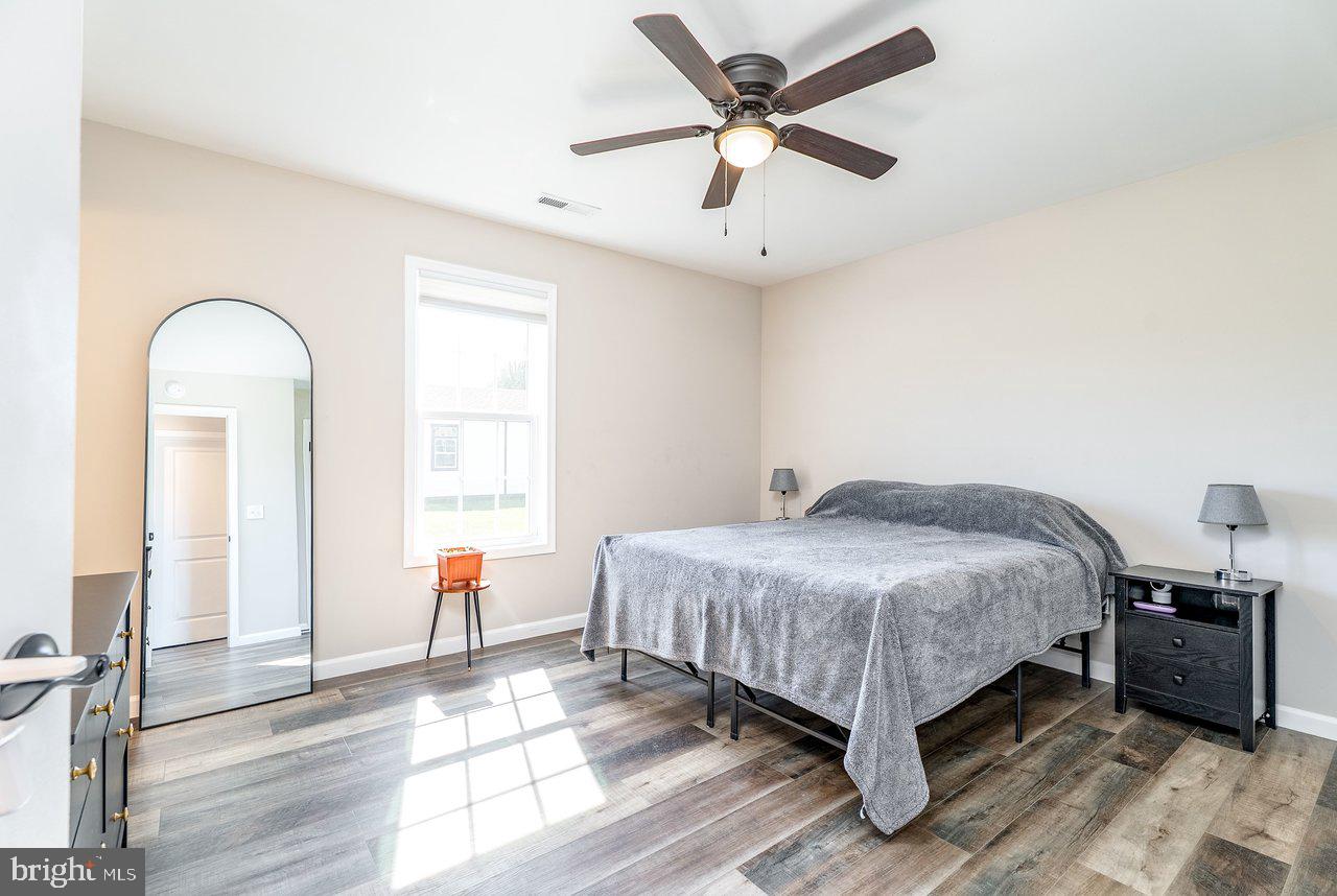 107 8th Street Grottoes, VA 24441 - Photo 23 of 45 a bedroom with a bed and a chandelier