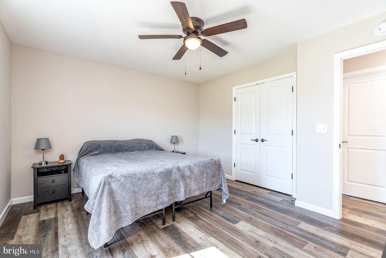 107 8th Street Grottoes, VA 24441 - Photo 24 of 45 a bedroom with a bed and a chandelier