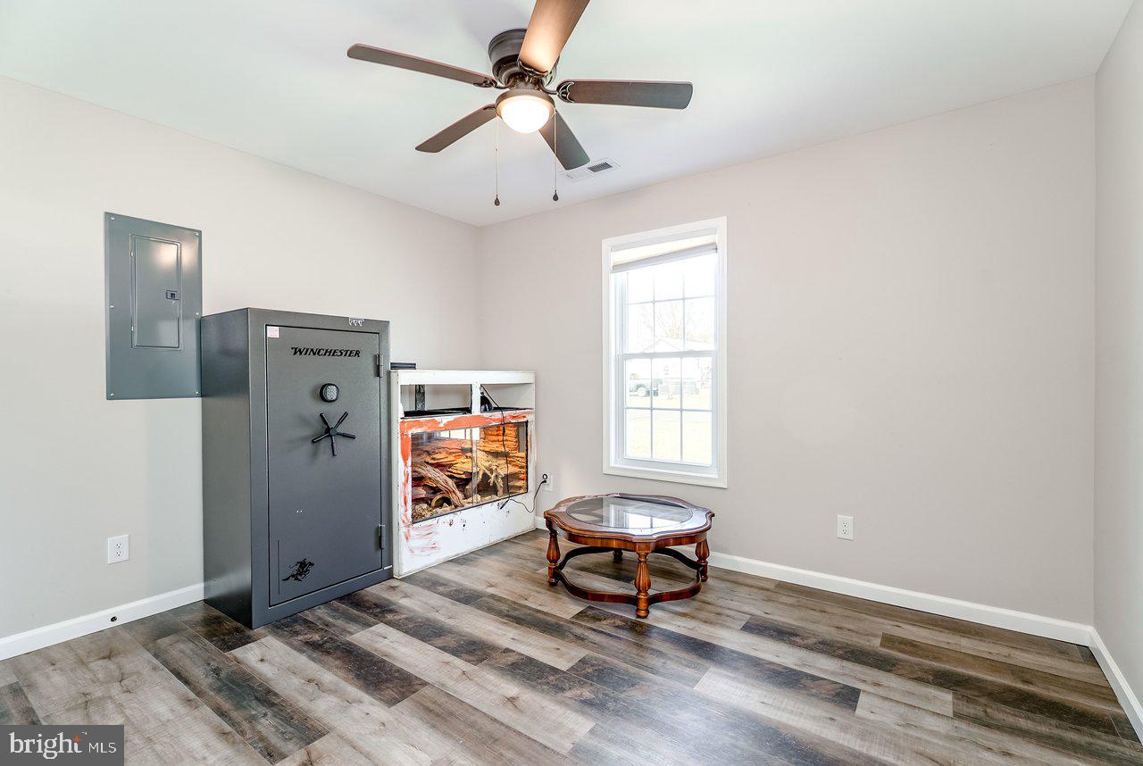 107 8th Street Grottoes, VA 24441 - Photo 31 of 45 a living room with furniture a window and a ceiling fan