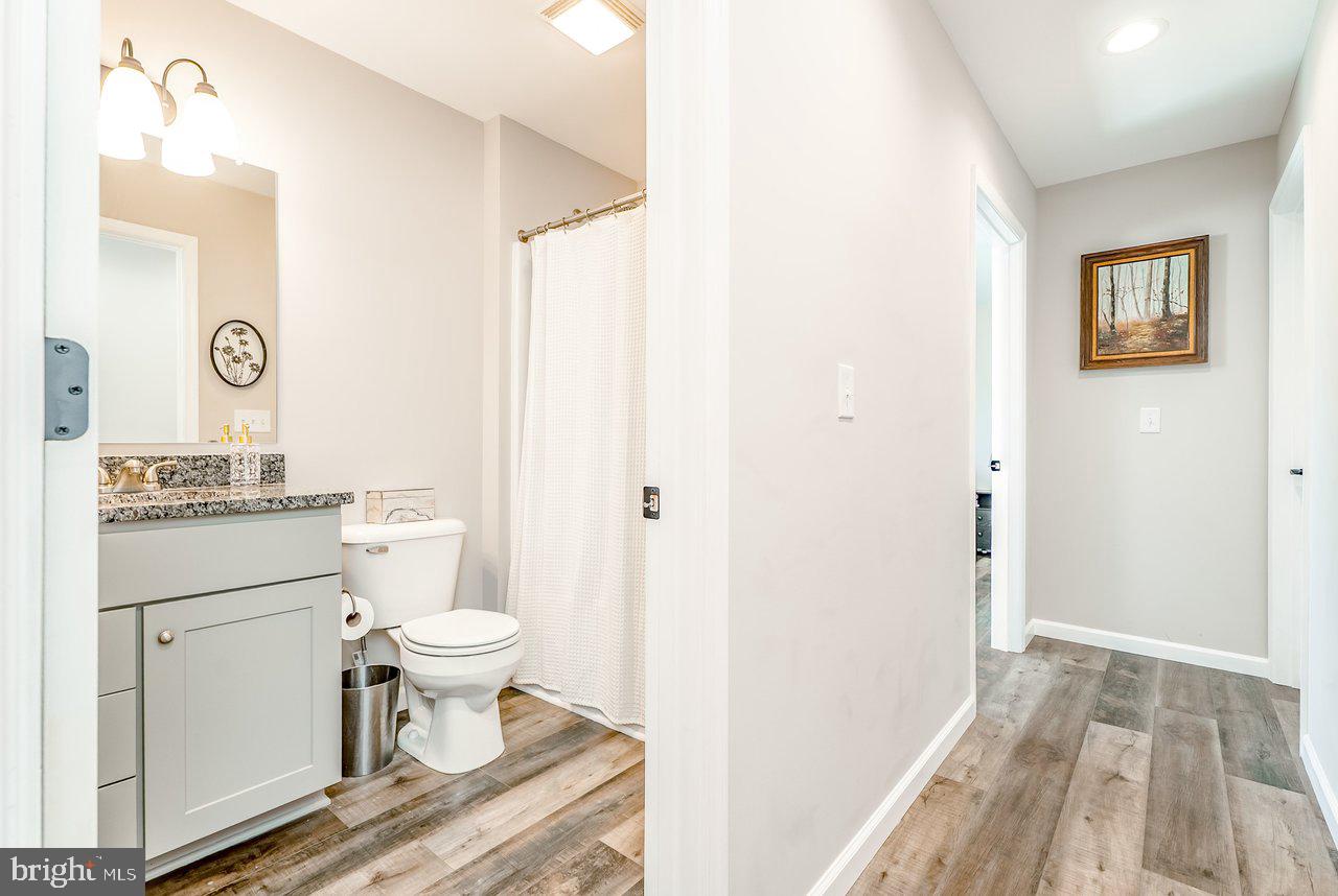 107 8th Street Grottoes, VA 24441 - Photo 33 of 45 a bathroom with a sink toilet and shower