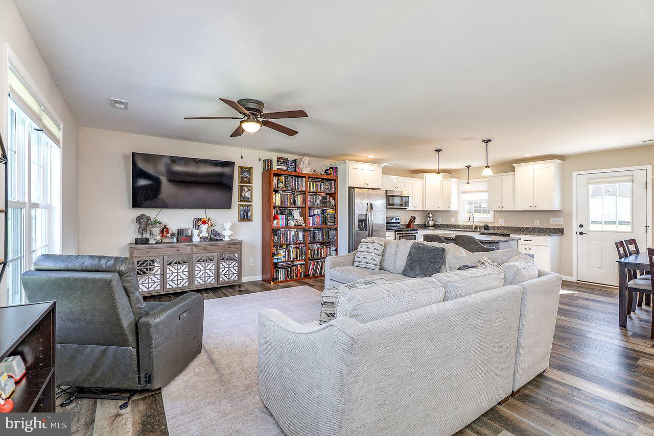 107 8th Street Grottoes, VA 24441 - Photo 5 of 45 a living room with furniture kitchen view and a flat screen tv