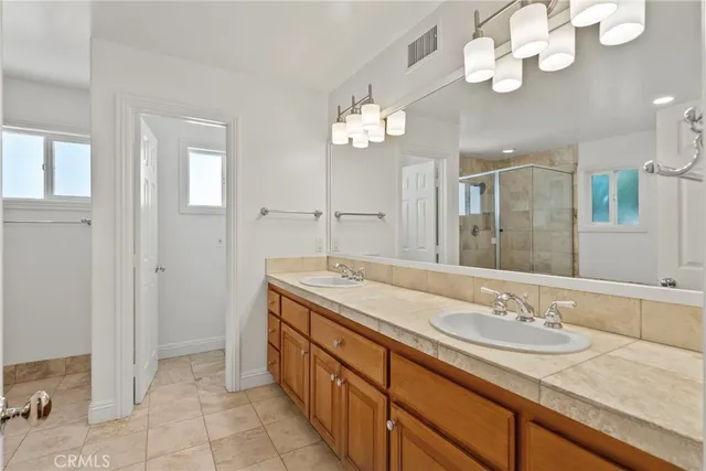 a bathroom with a sink and shower