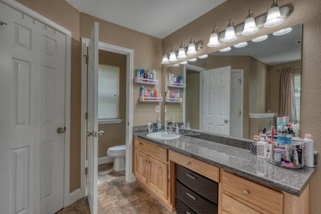 a bedroom with furniture and a window