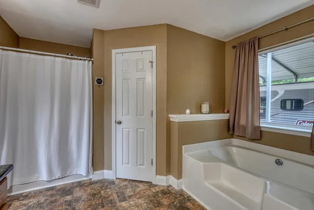 a view of a workspace with wooden floor