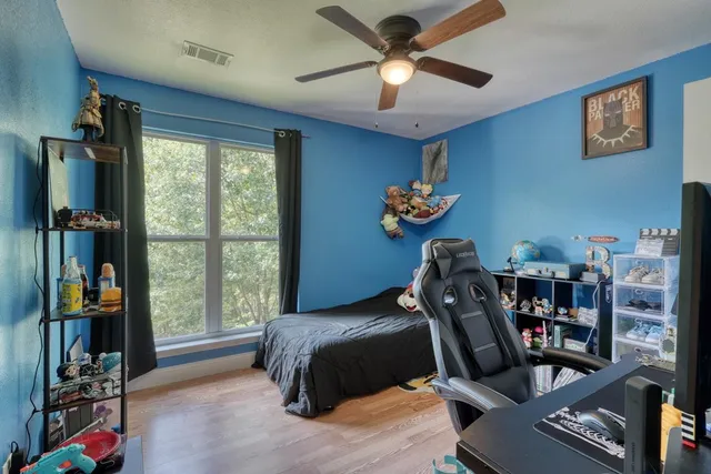 a bedroom with furniture and a window