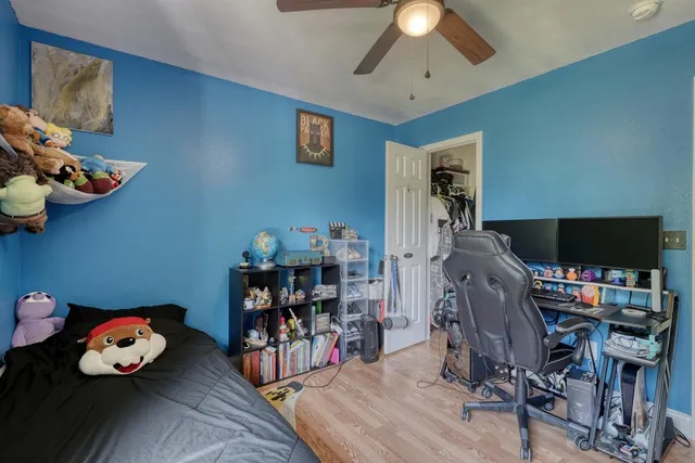 a bathroom with a sink toilet mirror and shower