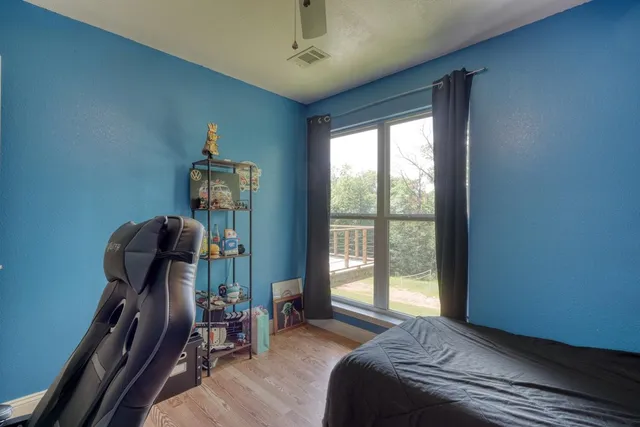 a bedroom with a bed and furniture