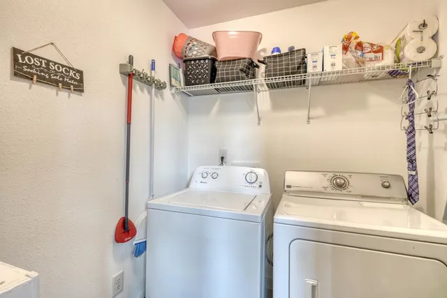 a view of a balcony with wooden floor and fence