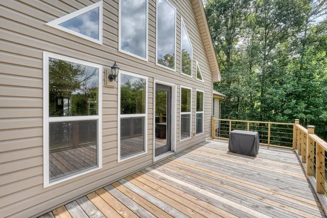 a view of yard with swimming pool and green space