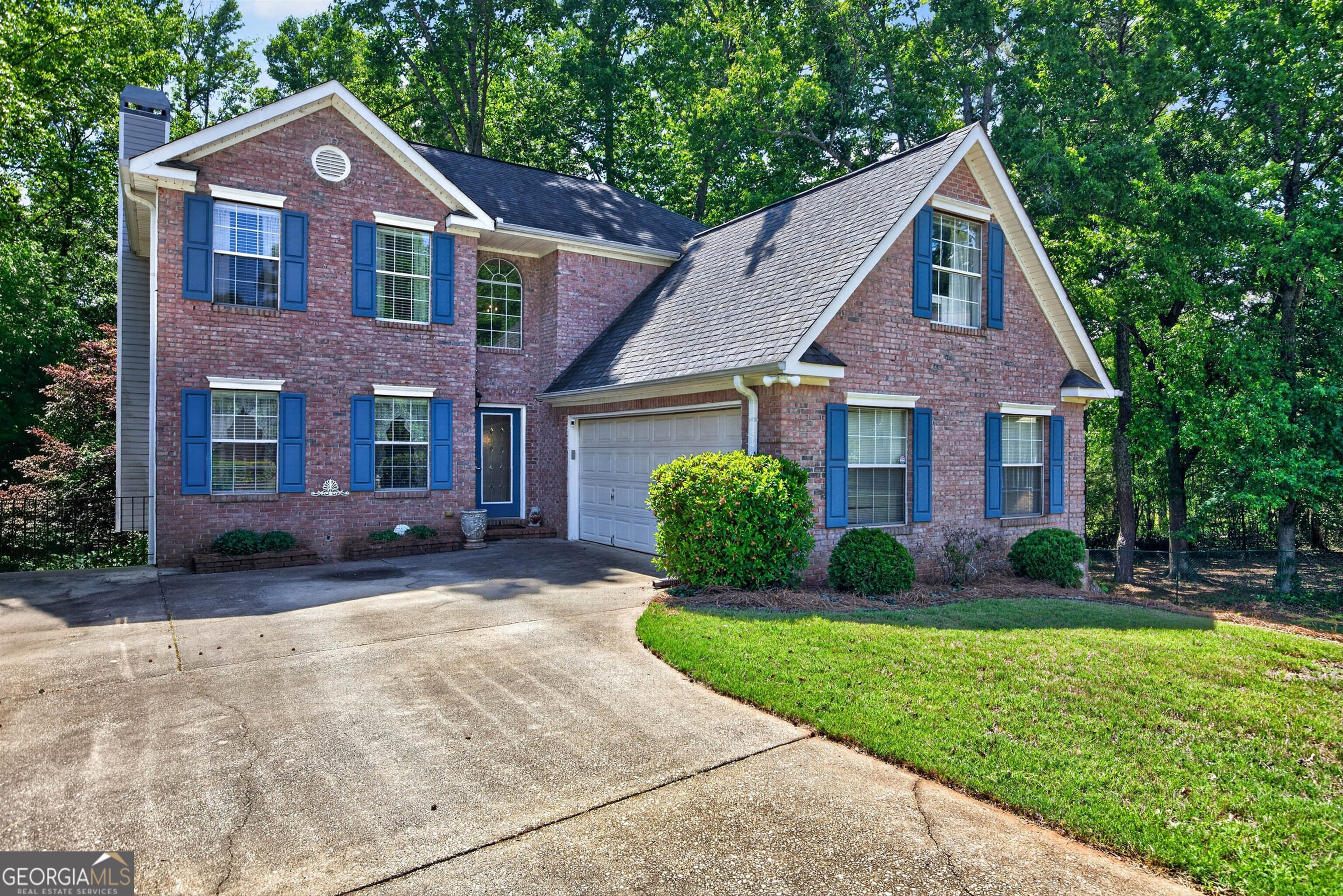 101 Emerald Lane Hampton, GA 30228 - Photo 5 of 72 a front view of a house with a yard