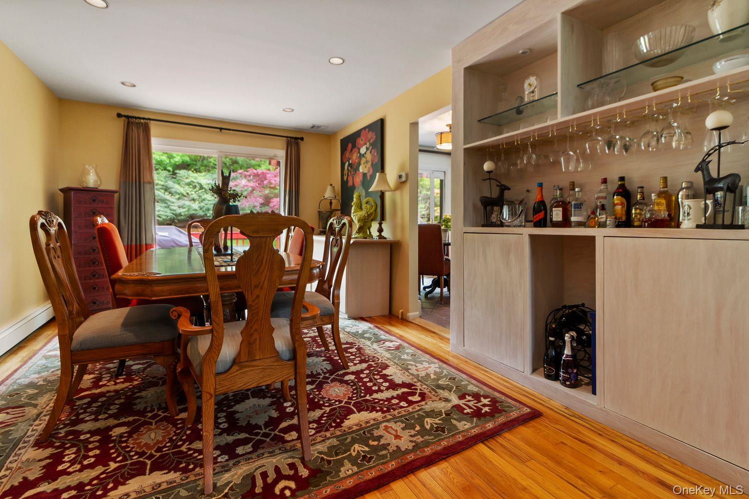 12 Ilana Court Armonk, NY 10504 - Photo 17 of 33 a view of a dining room with furniture window and wooden floor