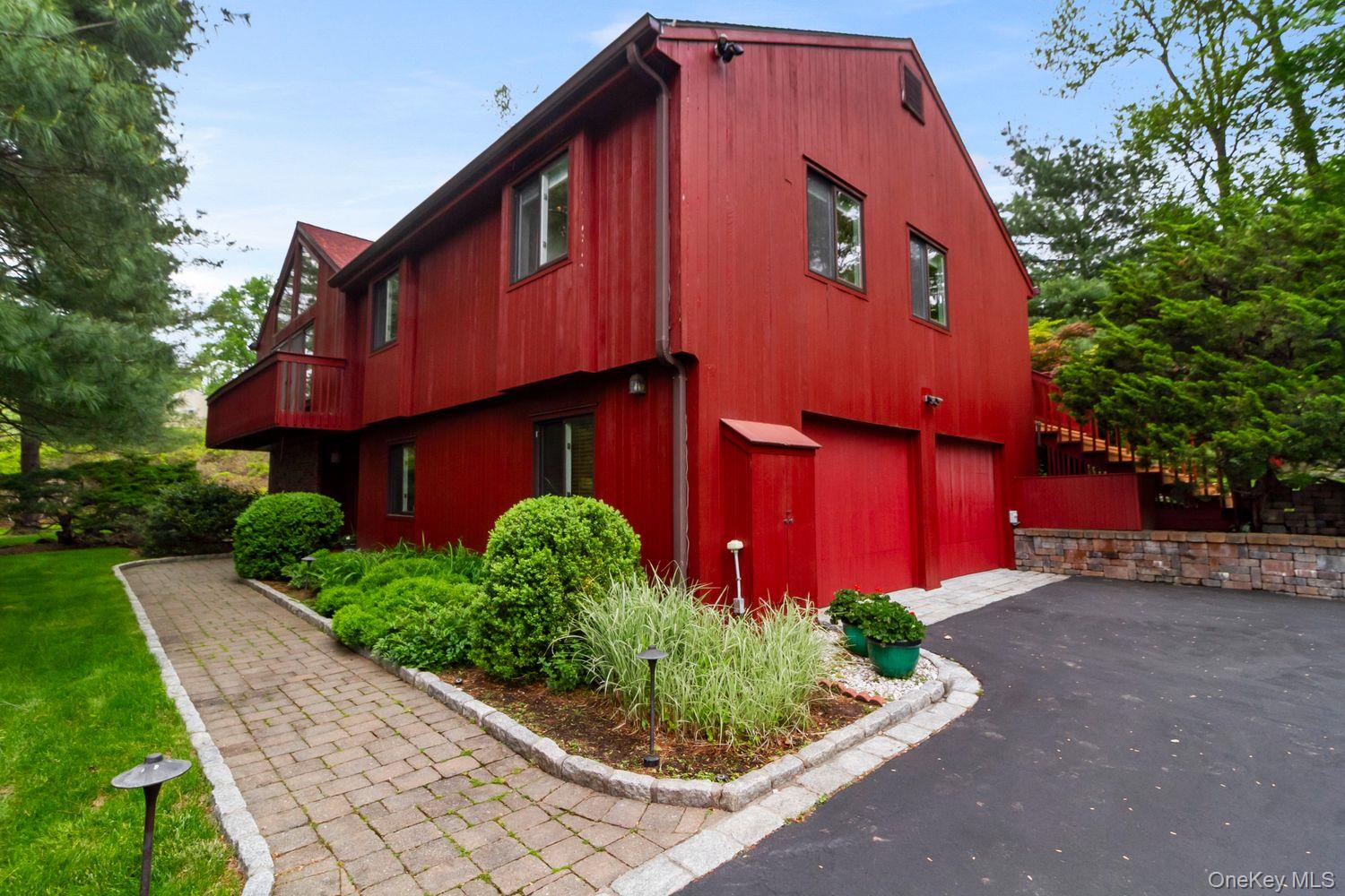 12 Ilana Court Armonk, NY 10504 - Photo 2 of 33 a front view of a house with garden