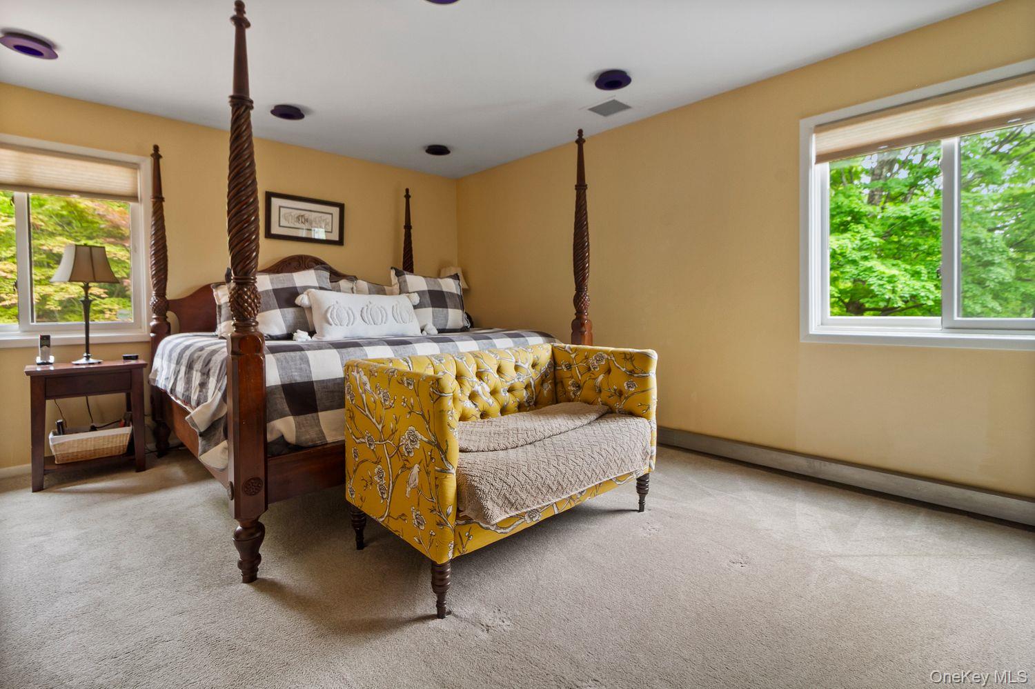 12 Ilana Court Armonk, NY 10504 - Photo 23 of 33 a bedroom with bed and a large window