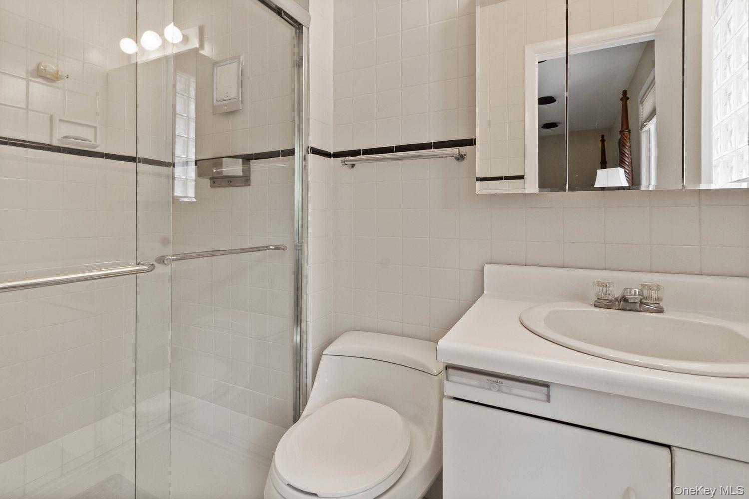 12 Ilana Court Armonk, NY 10504 - Photo 24 of 33 a bathroom with a sink toilet and shower