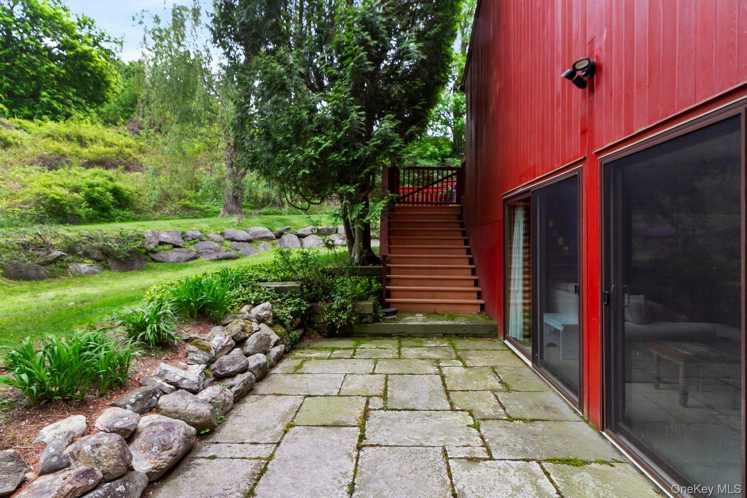 12 Ilana Court Armonk, NY 10504 - Photo 28 of 33 a view of a backyard with pathway