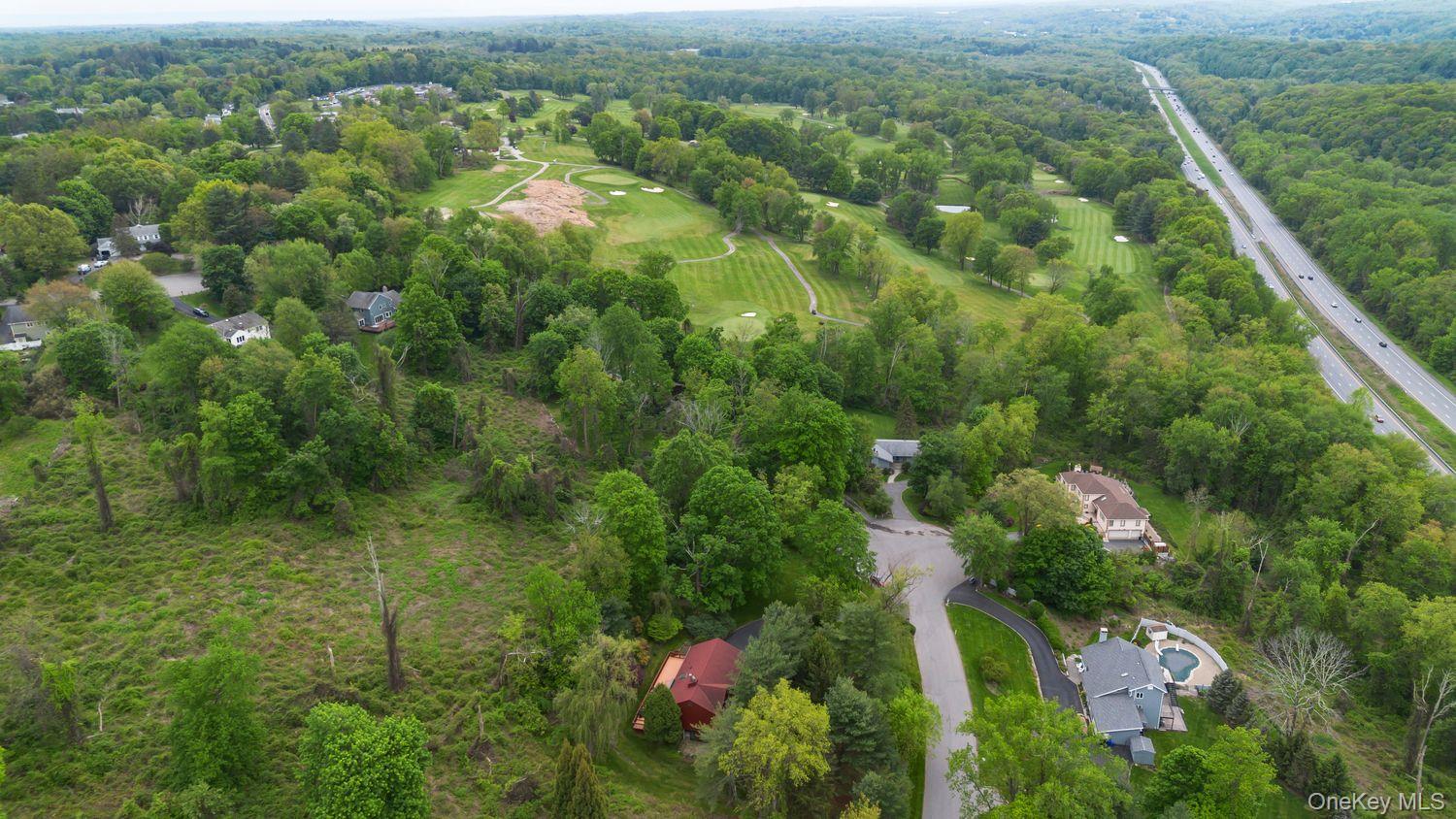 12 Ilana Court Armonk, NY 10504 - Photo 4 of 33 an aerial view of residential houses with outdoor space and trees