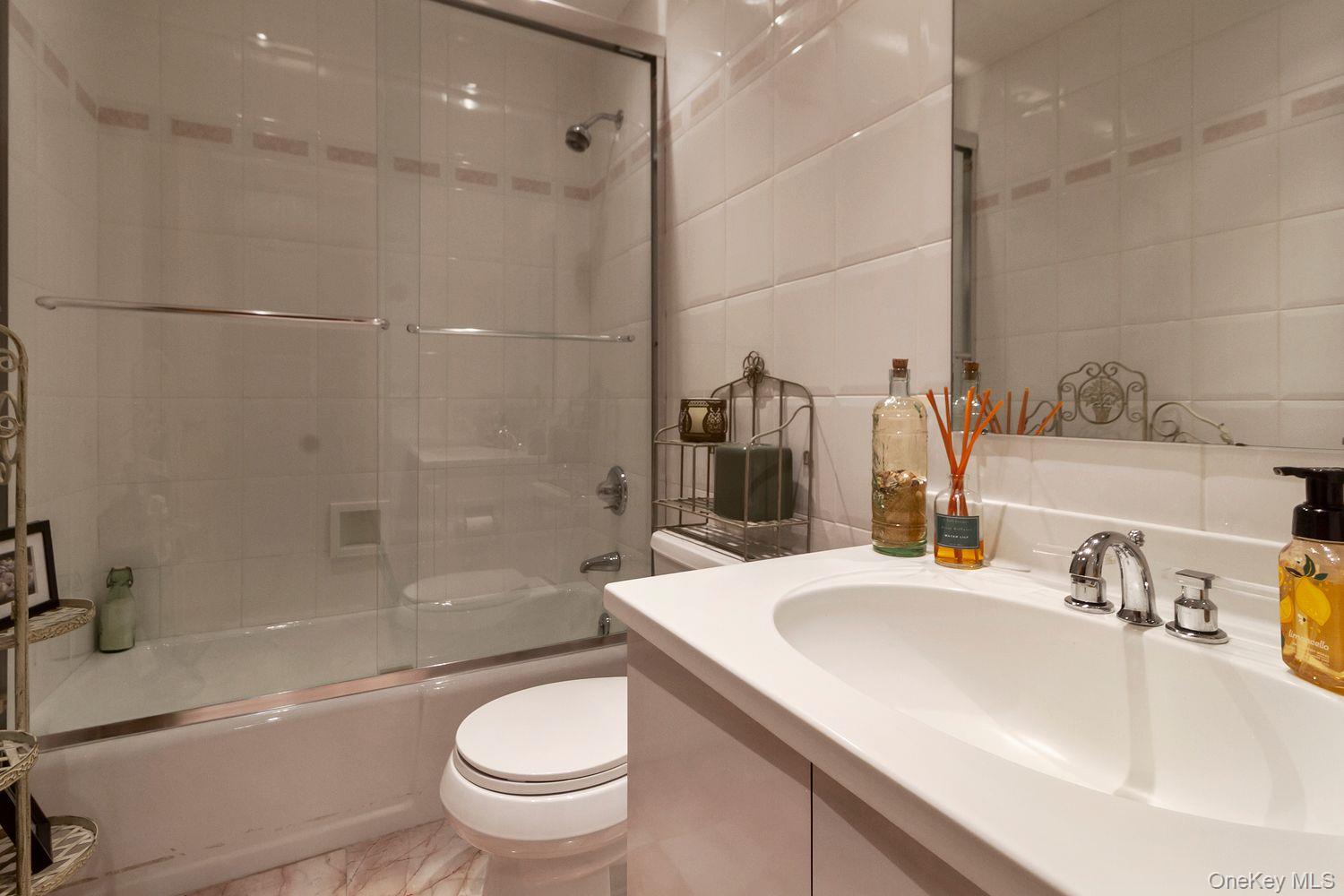 12 Ilana Court Armonk, NY 10504 - Photo 10 of 33 a bathroom with a sink toilet and shower