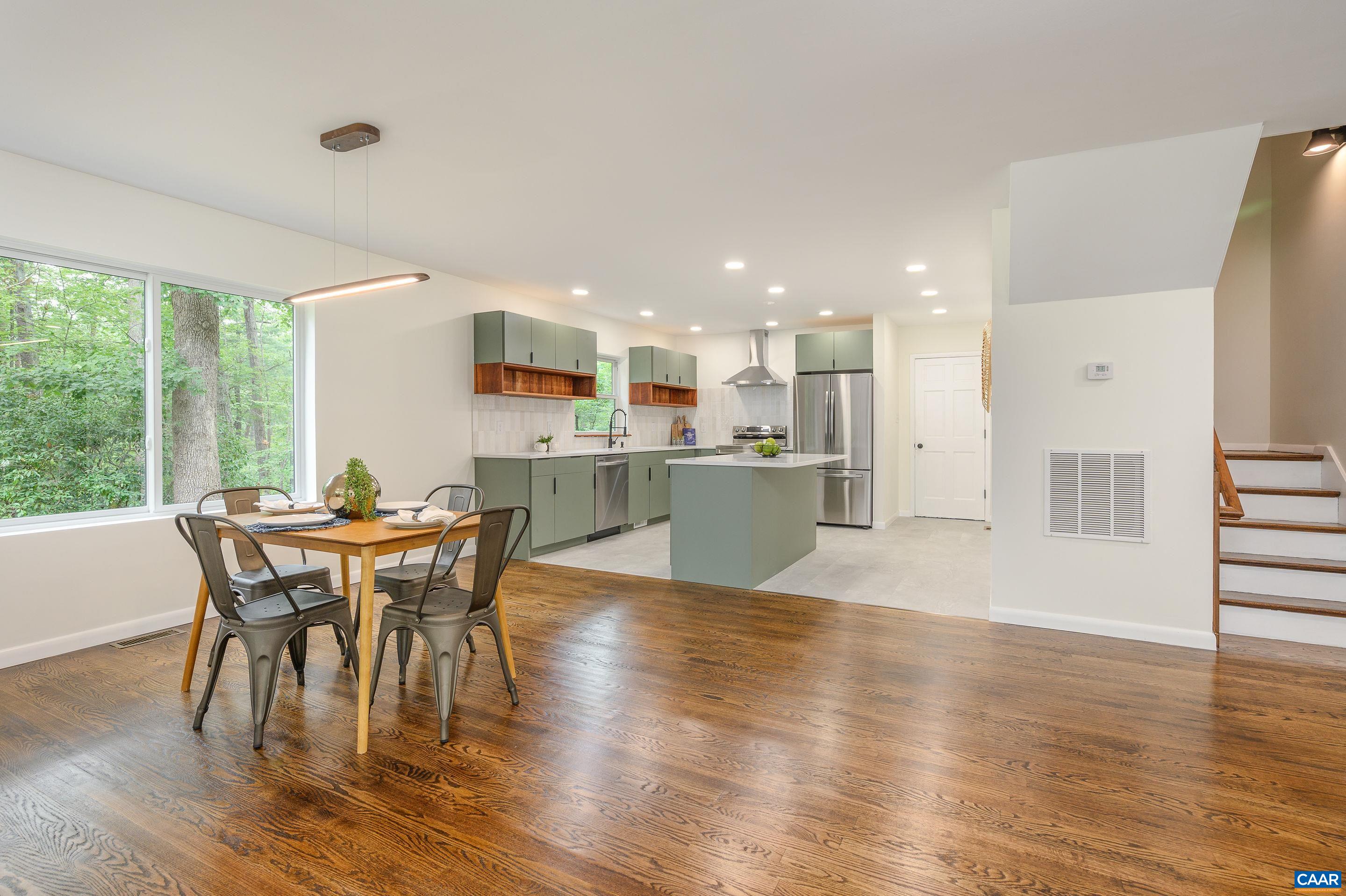 960 Broad Axe Road Charlottesville, VA 22903 - Photo 14 of 39 a view of a dining room with furniture and wooden floor