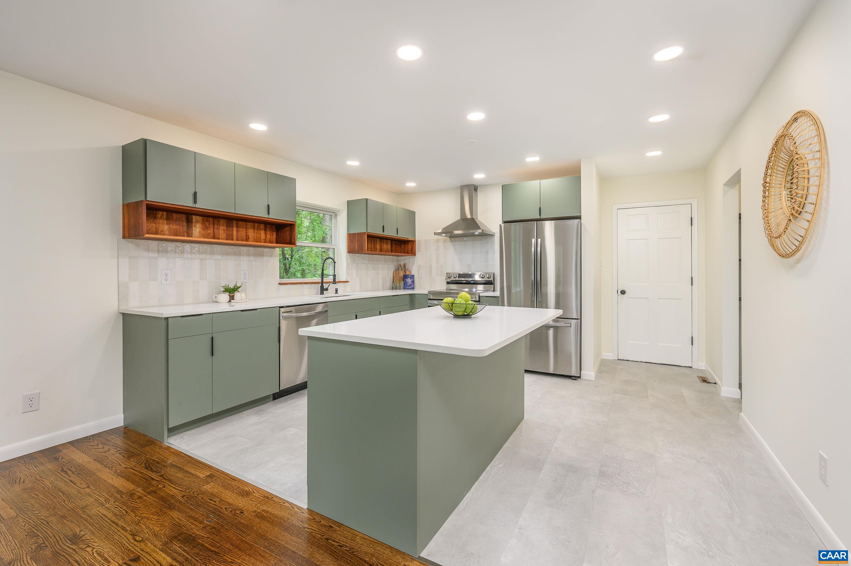 960 Broad Axe Road Charlottesville, VA 22903 - Photo 15 of 39 a kitchen with stainless steel appliances kitchen island granite countertop a sink and a refrigerator