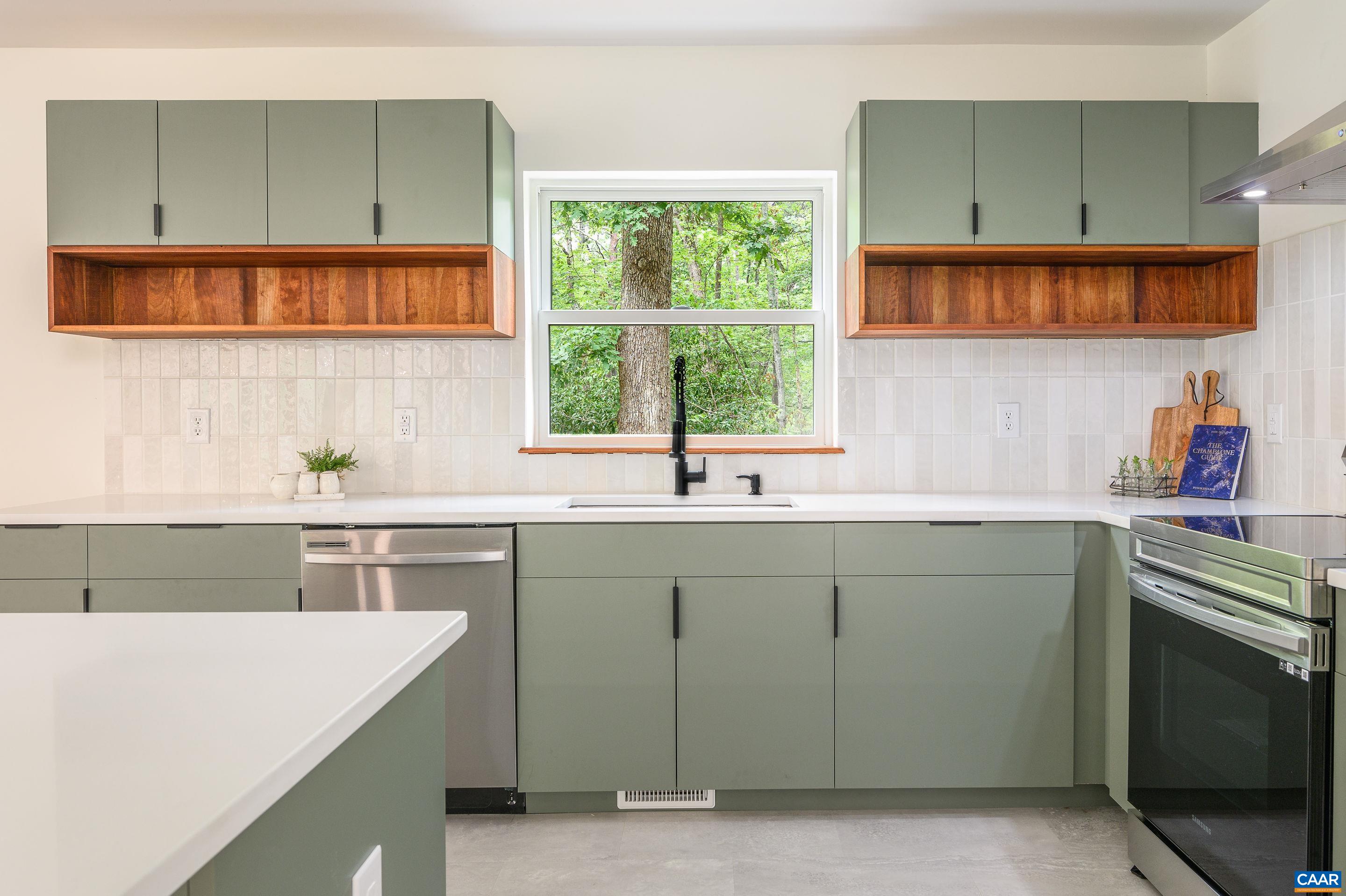 960 Broad Axe Road Charlottesville, VA 22903 - Photo 17 of 39 a kitchen with a sink cabinets and window