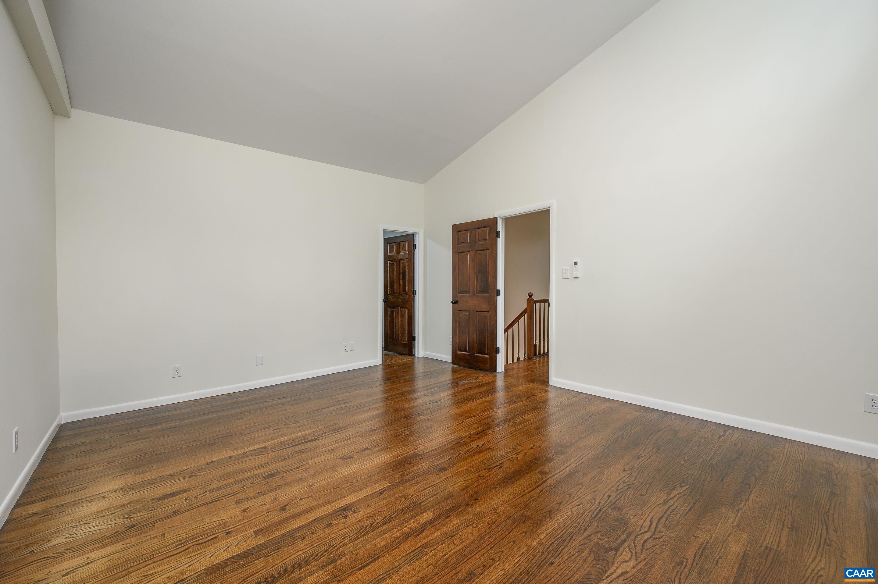 960 Broad Axe Road Charlottesville, VA 22903 - Photo 31 of 39 a view of an empty room with wooden floor and a window