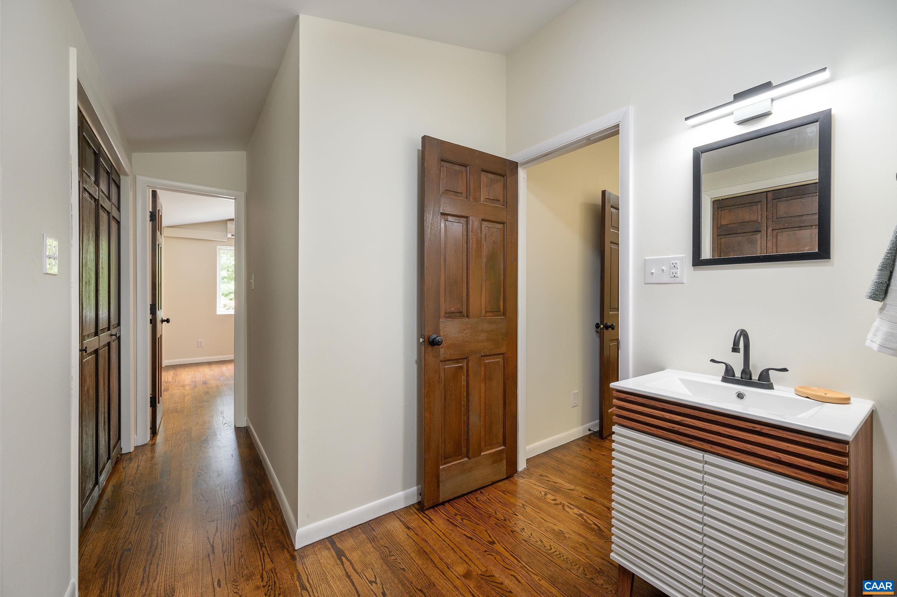 960 Broad Axe Road Charlottesville, VA 22903 - Photo 33 of 39 a bathroom with a sink and a mirror