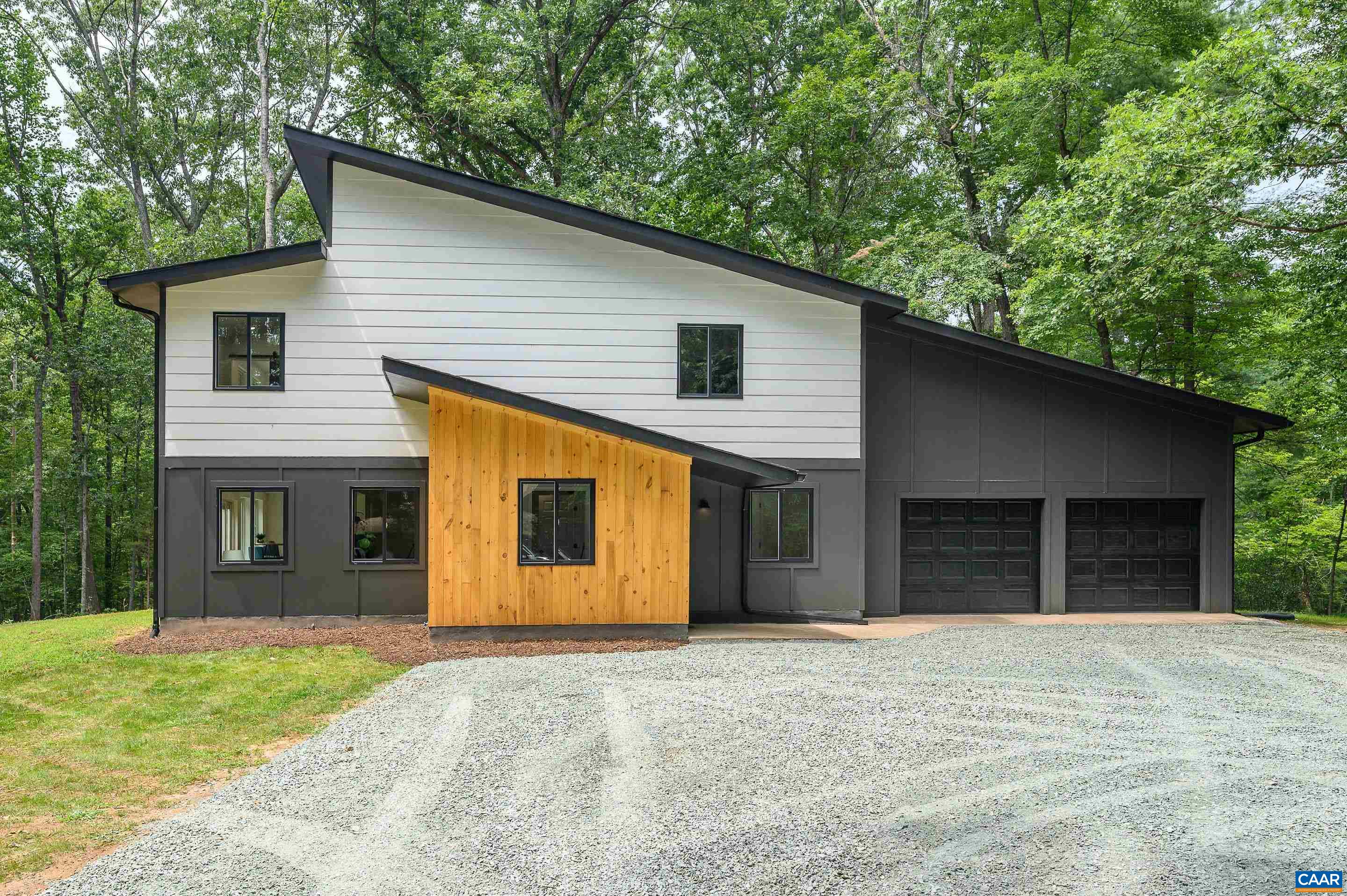 960 Broad Axe Road Charlottesville, VA 22903 - Photo 5 of 39 a front view of a house with a yard and garage