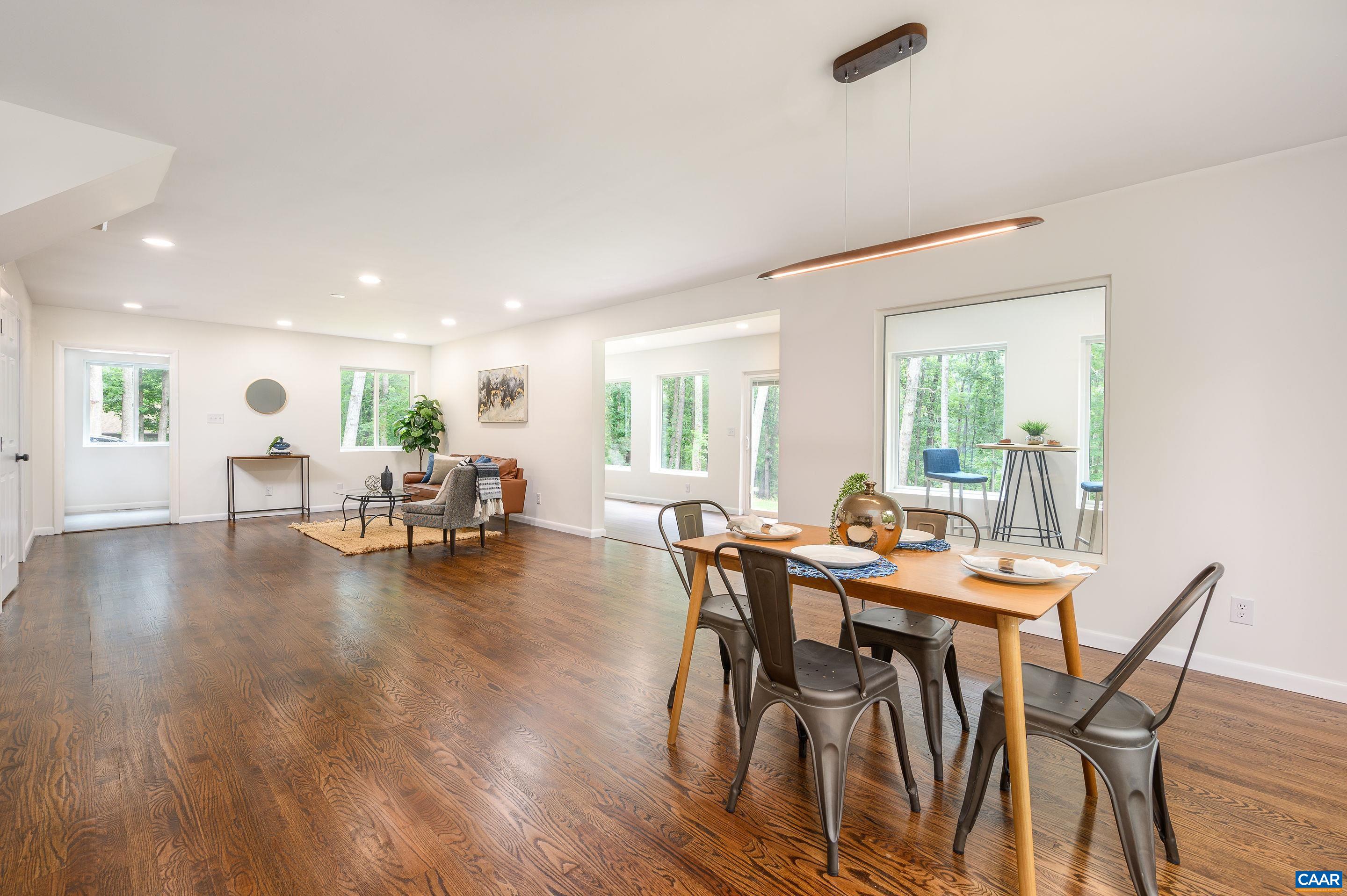 960 Broad Axe Road Charlottesville, VA 22903 - Photo 9 of 39 a view of a dining room with furniture and wooden floor