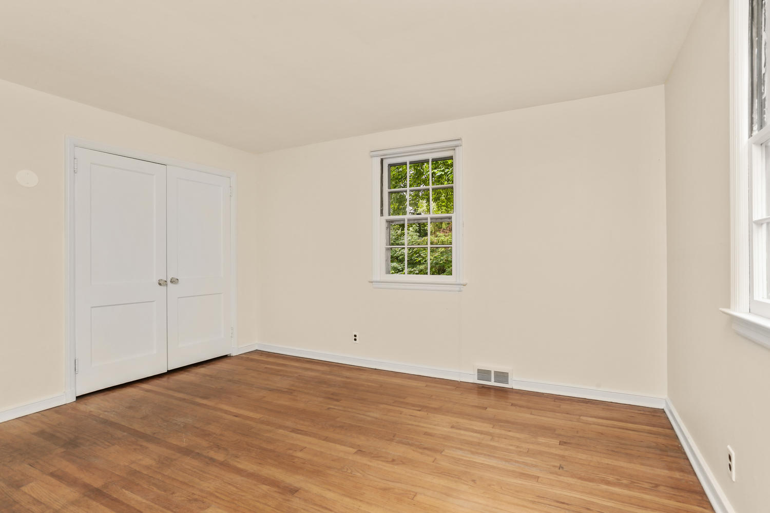 9 Alpine Lane Darien, CT 06820 - Photo 11 of 23 an empty room with wooden floor and windows