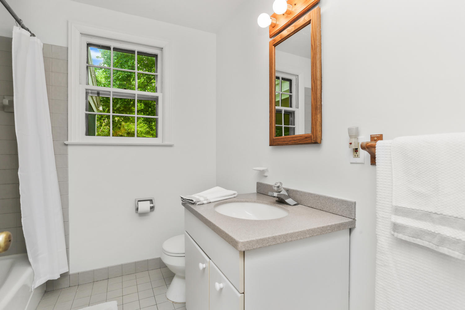 9 Alpine Lane Darien, CT 06820 - Photo 13 of 23 a bathroom with a sink a toilet and a window