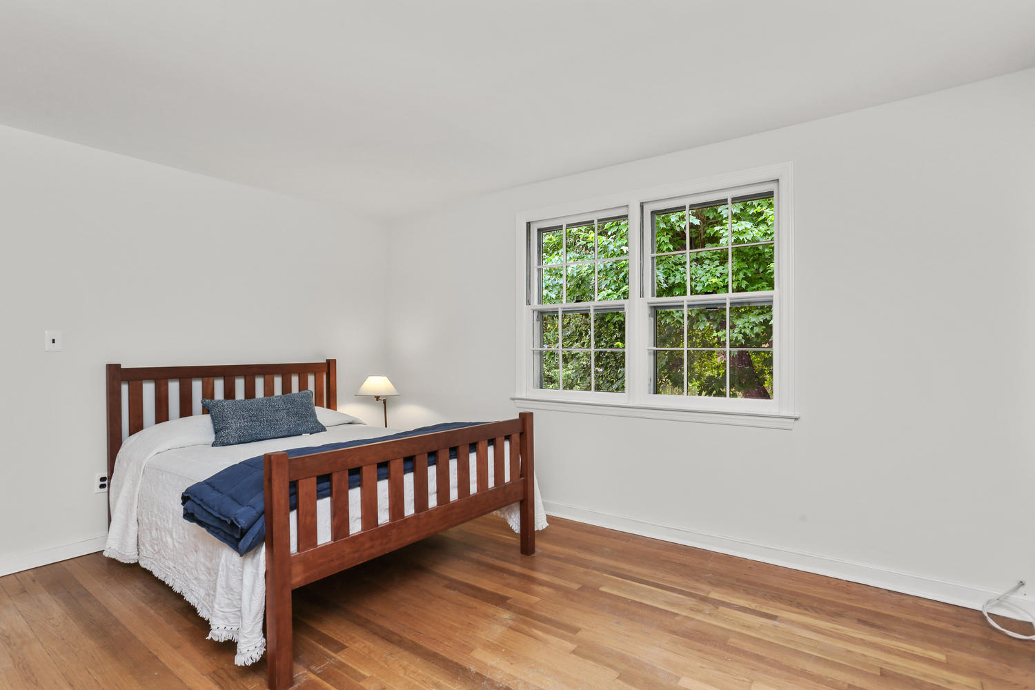 9 Alpine Lane Darien, CT 06820 - Photo 14 of 23 a bed sitting in a bedroom next to a window