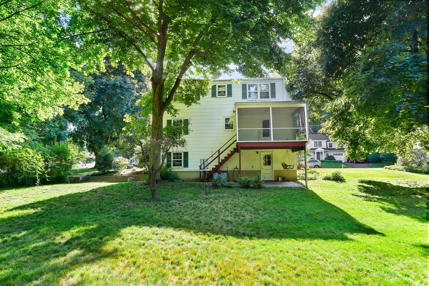 9 Alpine Lane Darien, CT 06820 - Photo 18 of 23 a front view of house with yard and green space