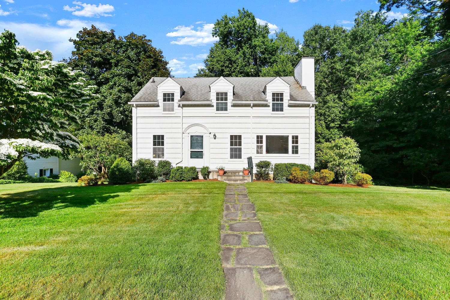 9 Alpine Lane Darien, CT 06820 - Photo 20 of 23 a front view of a house with a yard