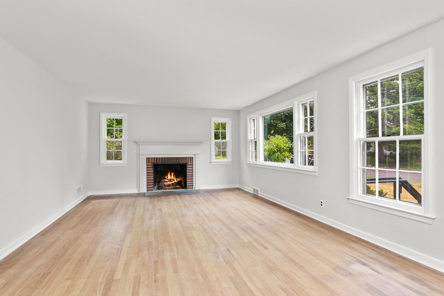 9 Alpine Lane Darien, CT 06820 - Photo 3 of 23 a view of an empty room with a window and fire place