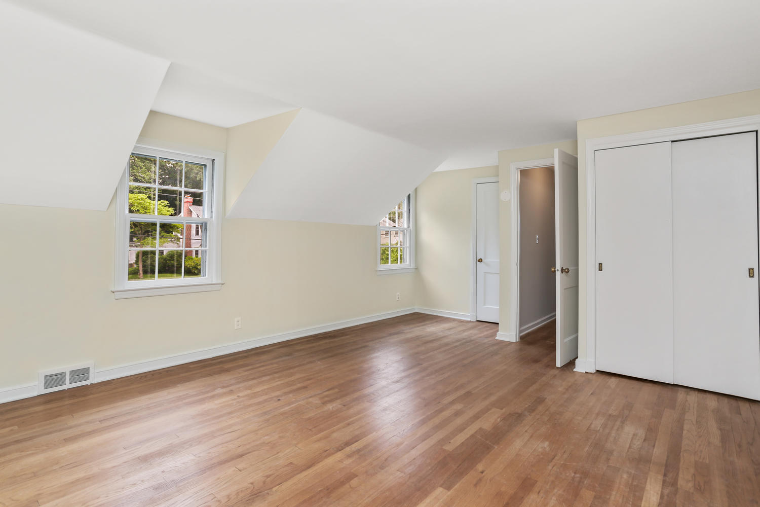9 Alpine Lane Darien, CT 06820 - Photo 10 of 23 an empty room with wooden floor and windows
