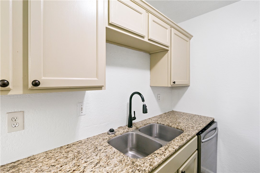 1503 Alpine Circle, Unit A College Station, TX 77840 - Photo 11 of 18 a kitchen with a sink and cabinets