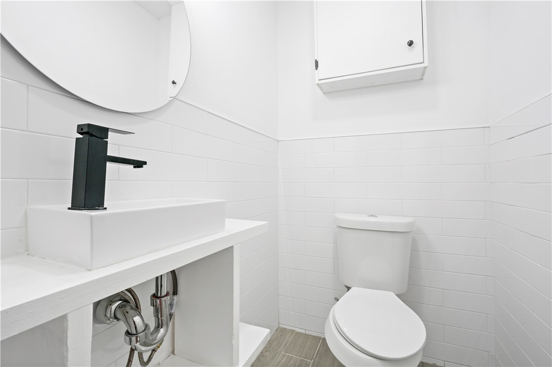 1503 Alpine Circle, Unit A College Station, TX 77840 - Photo 14 of 18 a white toilet sitting next to a shower