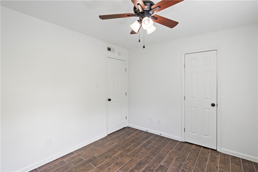 1503 Alpine Circle, Unit A College Station, TX 77840 - Photo 16 of 18 an empty room with a window and a fan