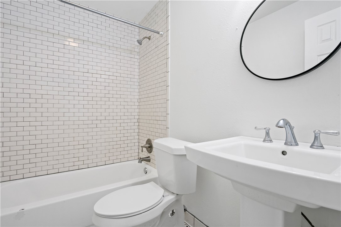 1503 Alpine Circle, Unit A College Station, TX 77840 - Photo 17 of 18 a bathroom with a sink toilet and shower