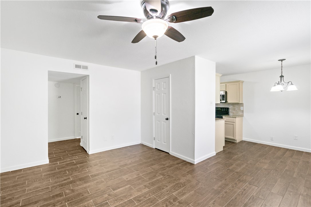 1503 Alpine Circle, Unit A College Station, TX 77840 - Photo 6 of 18 a view of an empty room with a kitchen